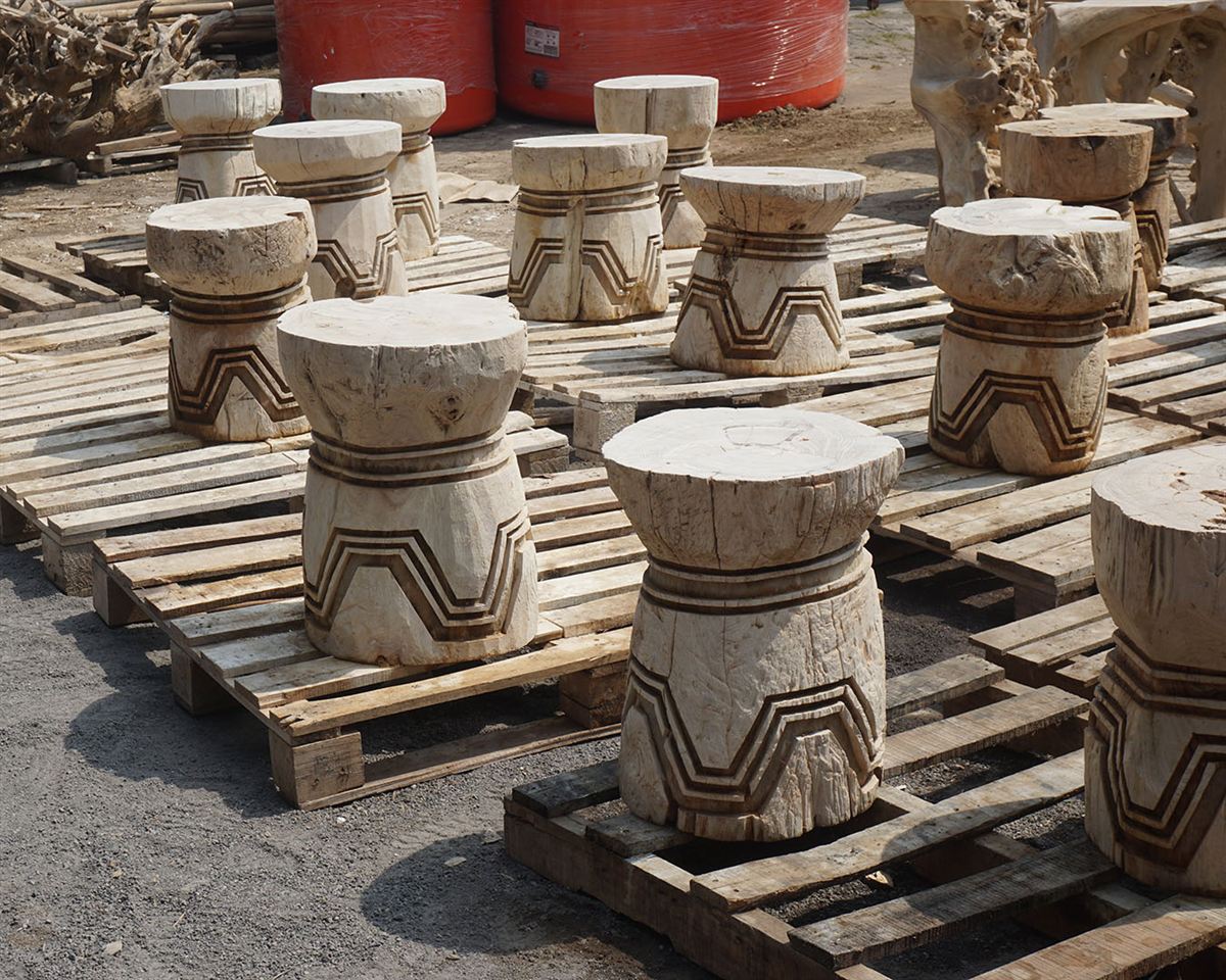 Rows of hand-carved wooden stools